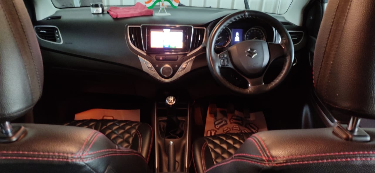 Car interior vacuum and dashboard cleaning by Mars Auto Care technicians
