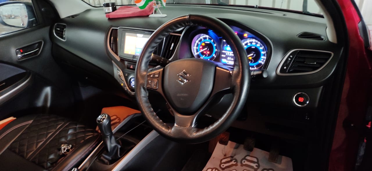 Car interior vacuum and dashboard cleaning by Mars Auto Care technicians